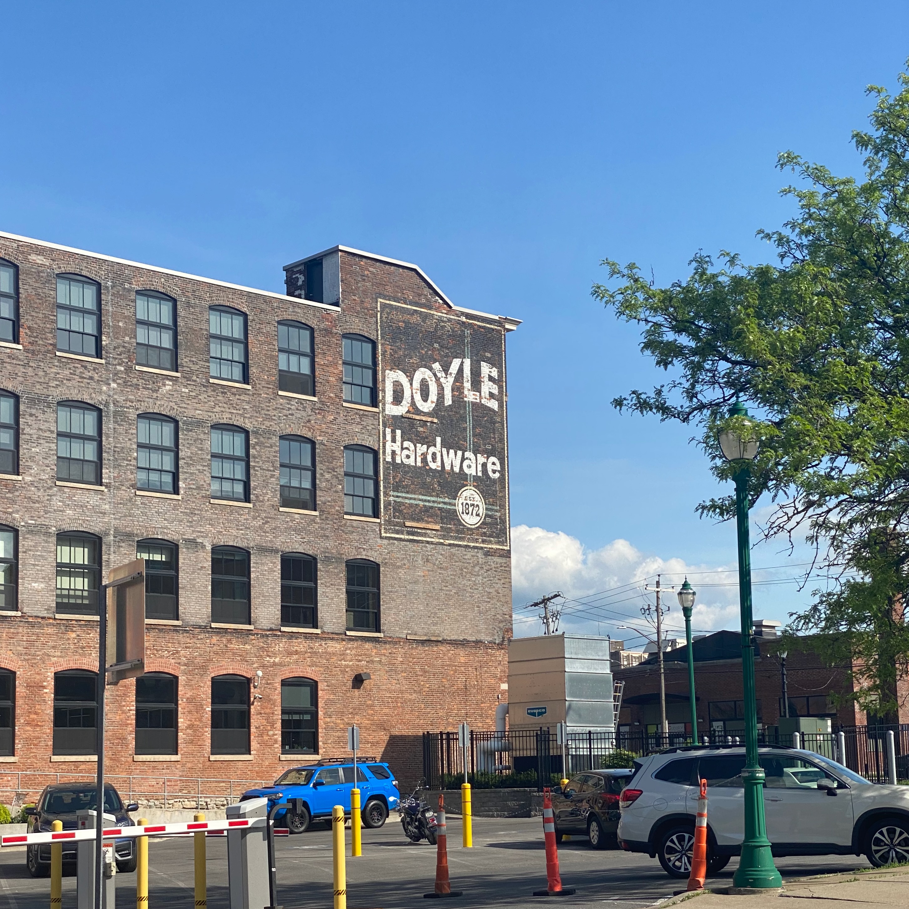 Vintage painted sign on a brick building in Downtown Utica, NY