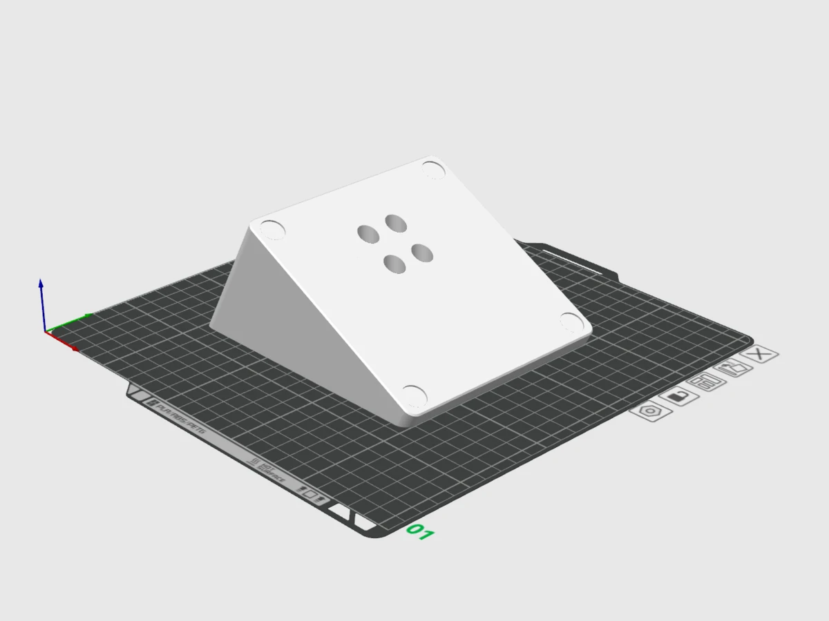 First wedge-shaped keyboard platform model viewed from above, showing its mounting holes.