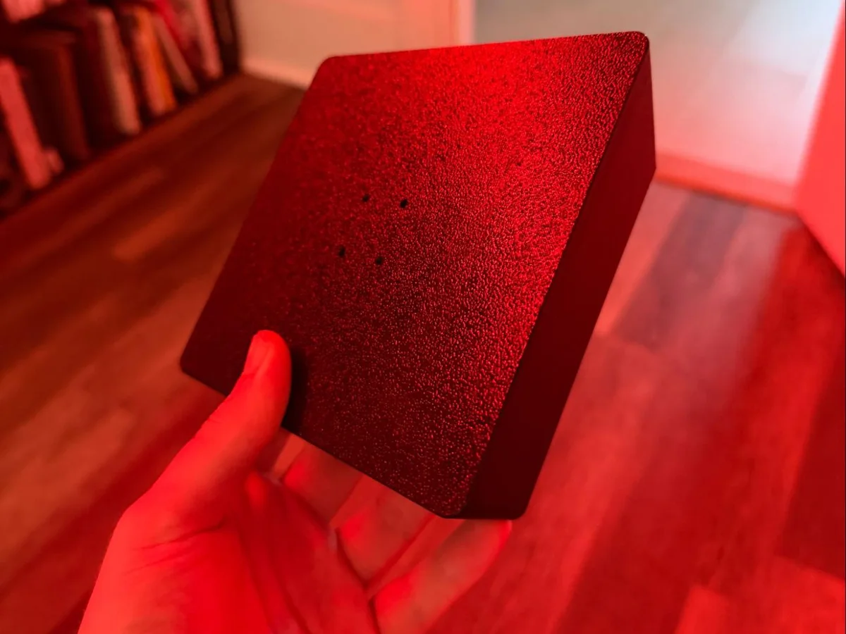 First printed keyboard platform held in one hand, showing the mounting surface.